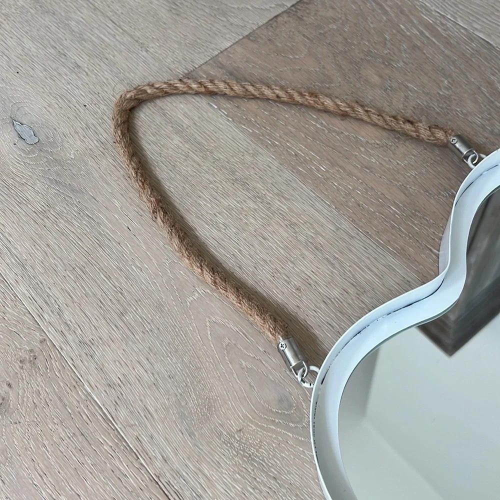 White hanging heart mirror on a rope. Coastal.